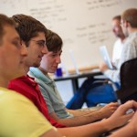 Permalink to Atomic Object’s Summer Interns 2012 A mentor working with two interns on an iPhone app