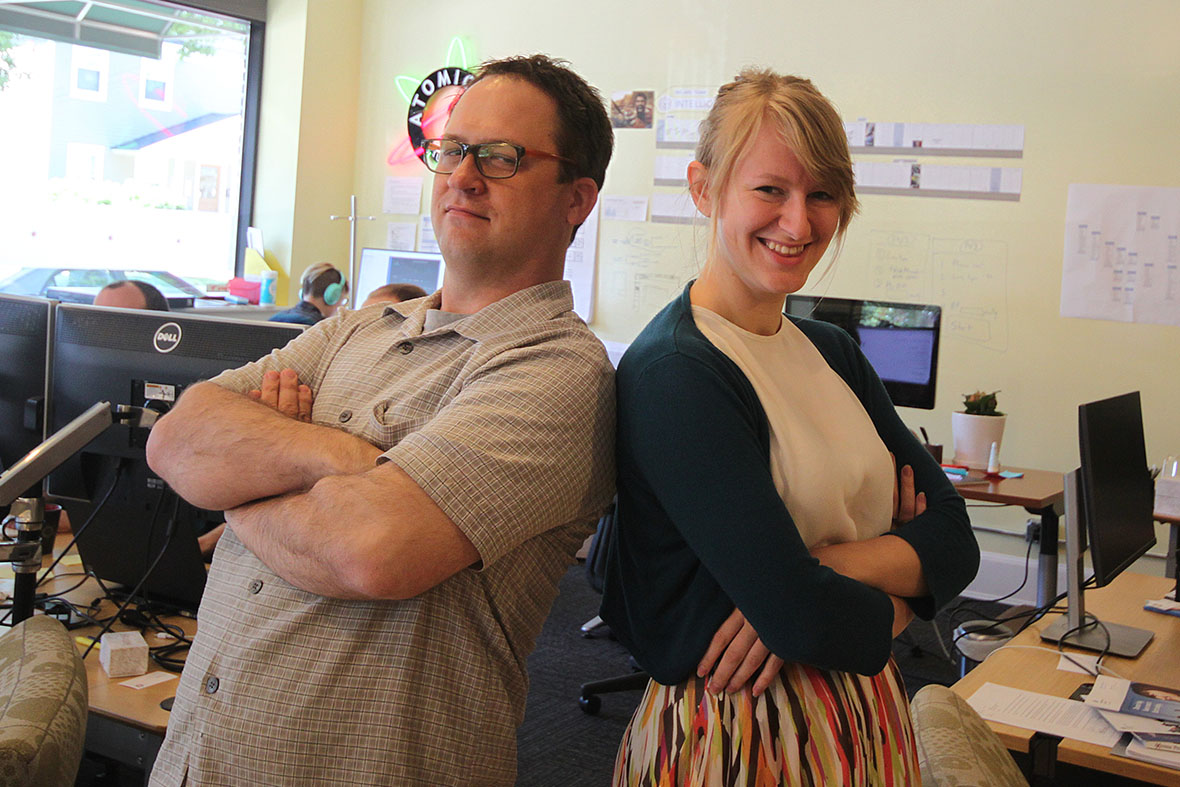 A Photo of Rachael Miller and Greg Williams posing together in the Atomic Object Grand Rapids office