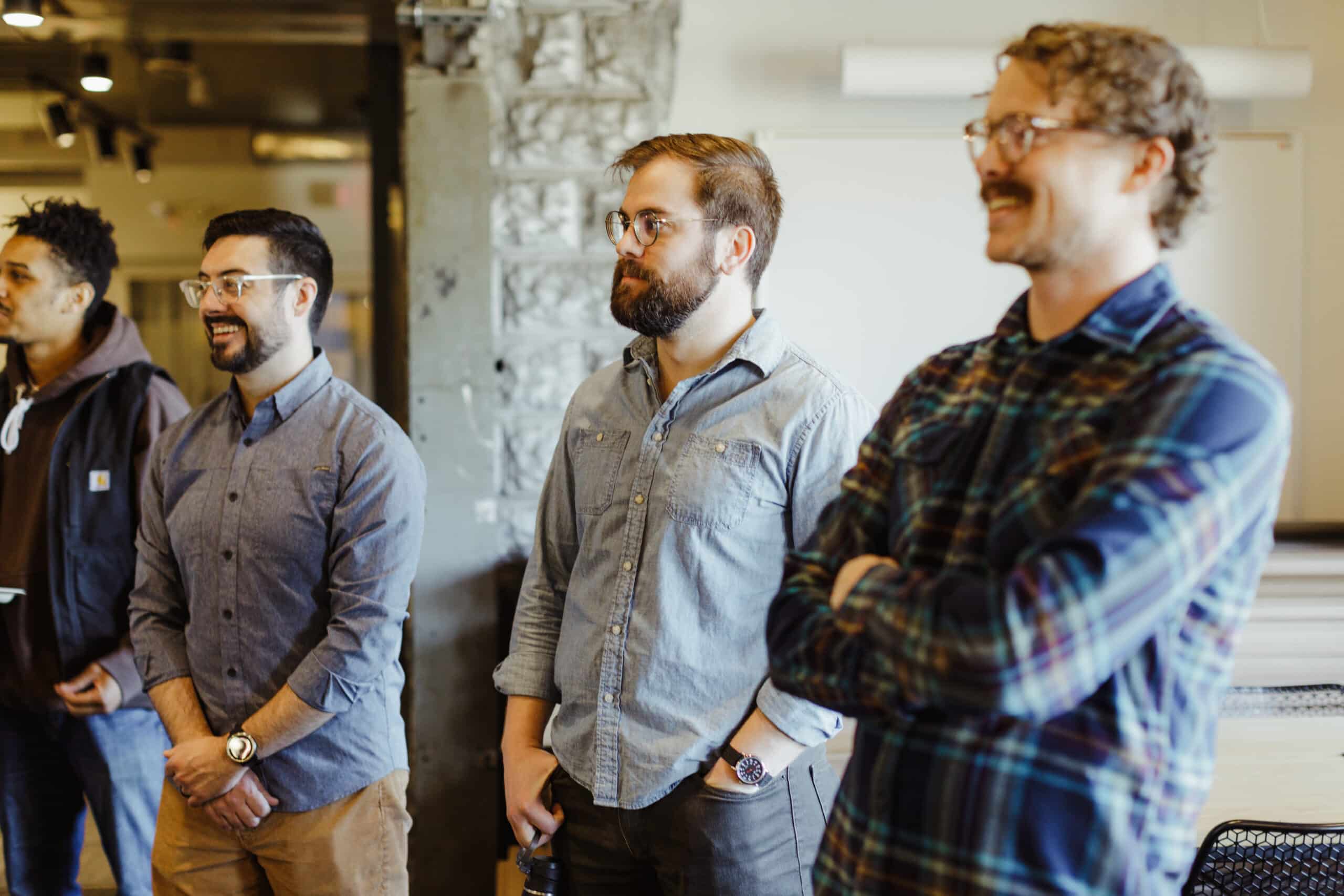 Pictured is author Patrick Pale with his colleagues at Atomic Object. Post title: Here's How I'm "Friction-Maxxing" in a Technical Role