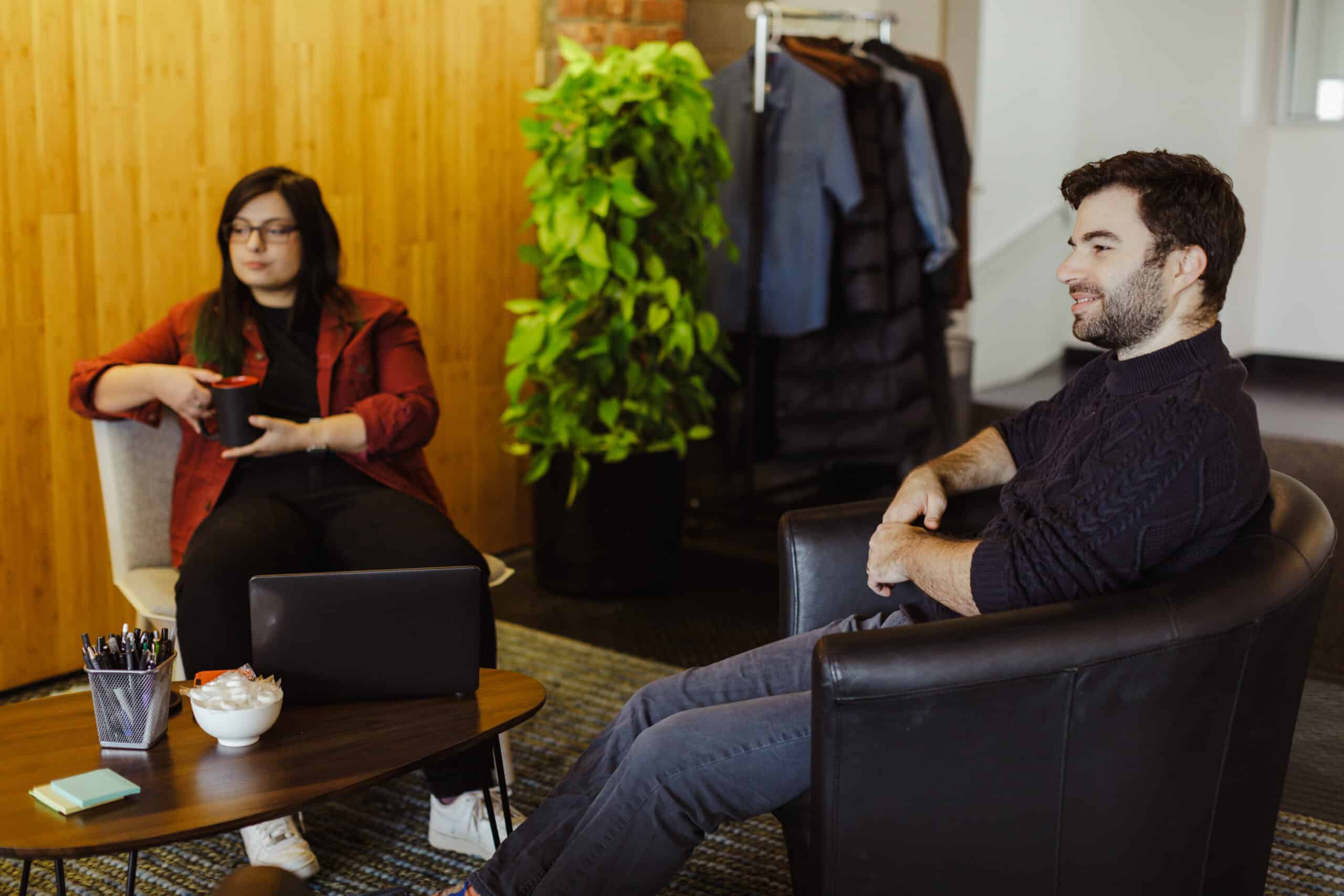 Pictured at right is author Nate Gittlen talking with a co-worker. Post title: Large Language Models Are Designed to Be Average