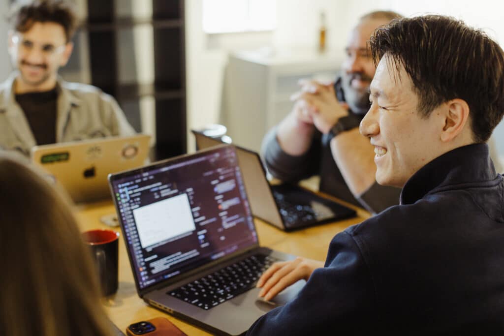 Blog post author Michael Li is pictured discussing with fellow developers: A Guide to Browser DevTools - The Console