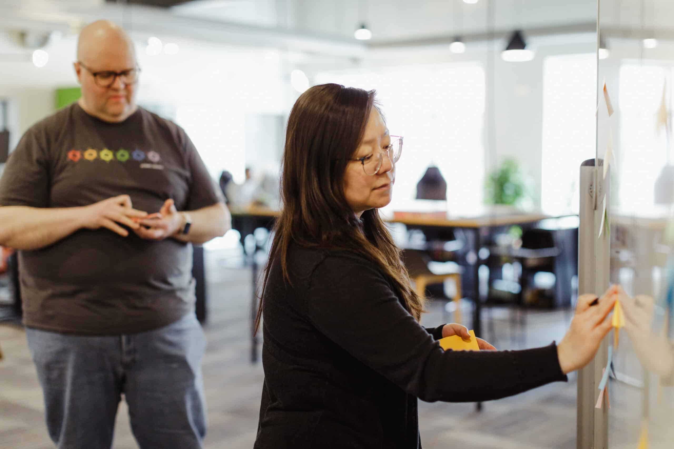 Pictured is author Jing Fan with a co-worker. Post title: Use JUnit Parameterized Tests to Force Test Coverage