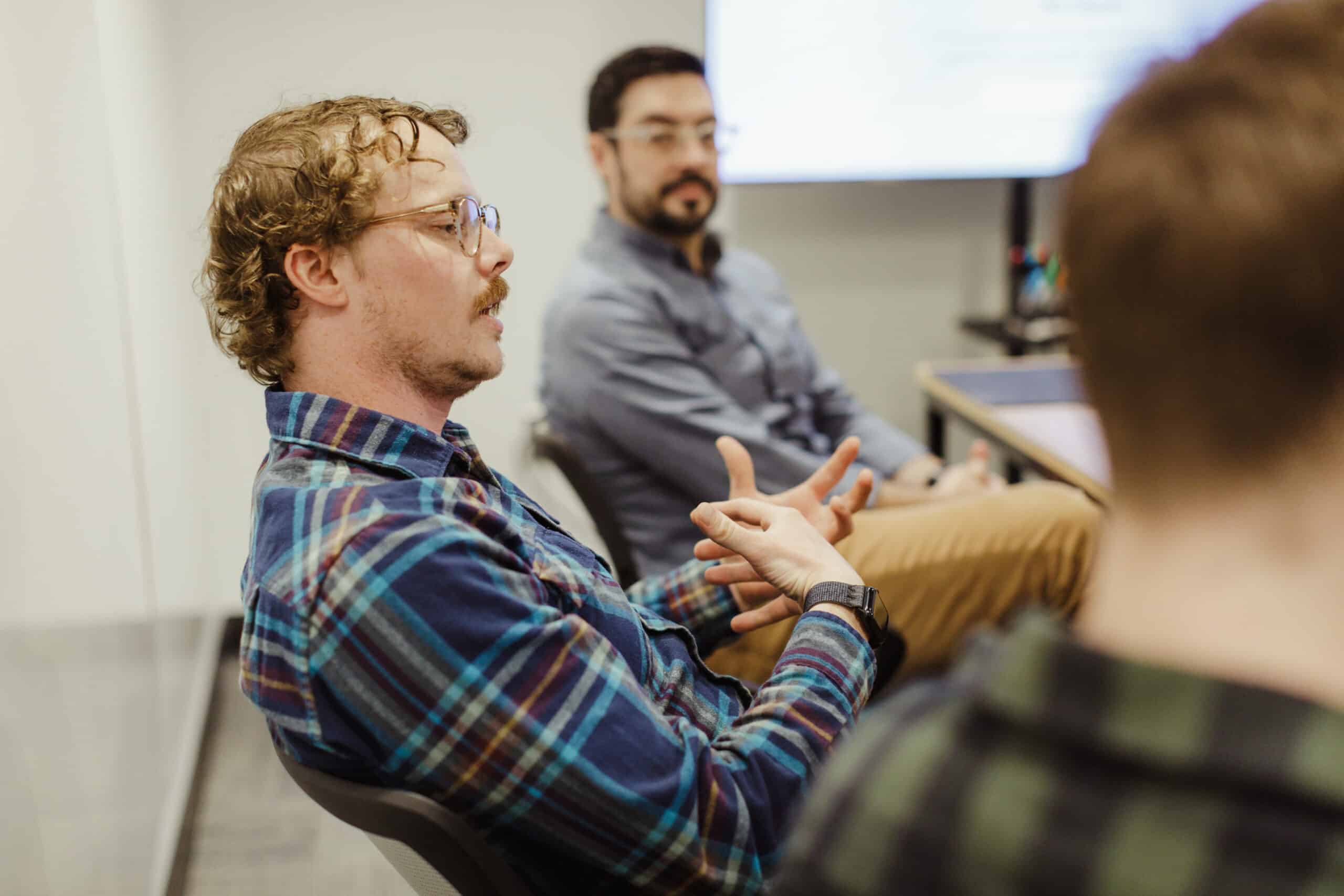 Author Ian Culver with his Atomic Object coworkers. Post title: Hard-Won Lessons From a Year of Using AI