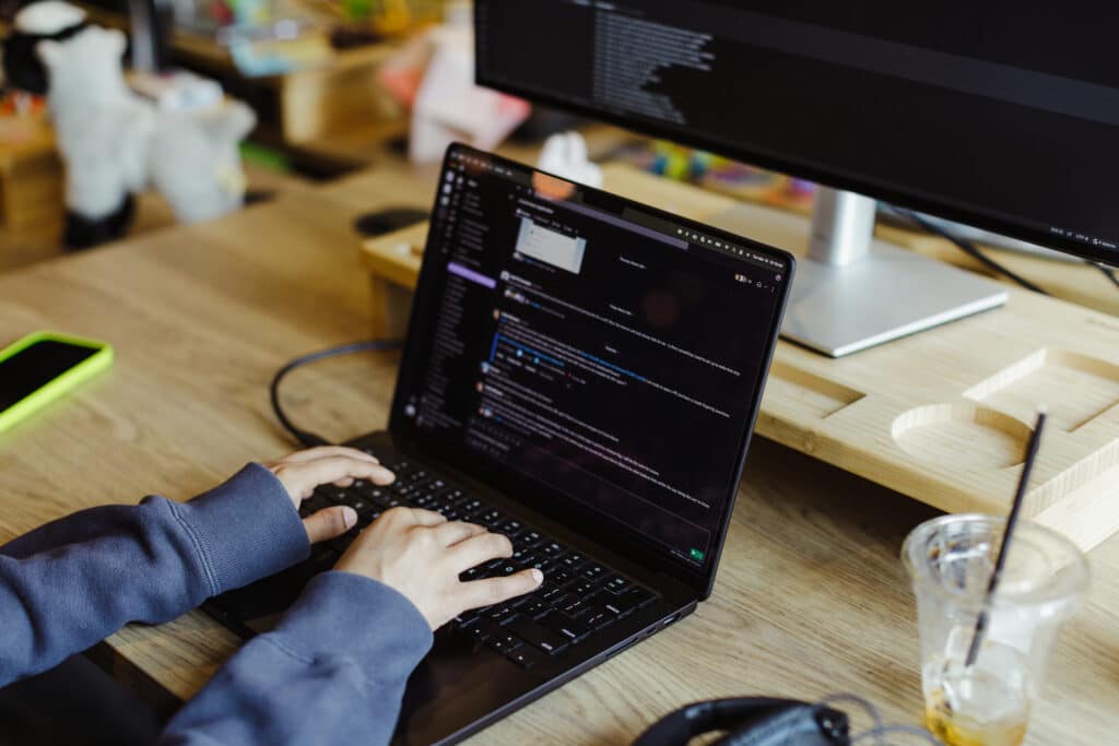Pictured are hands on a keyboard. Post title: How to Create a Chart with a Secondary Y Axis in React Native with Victory Native XL