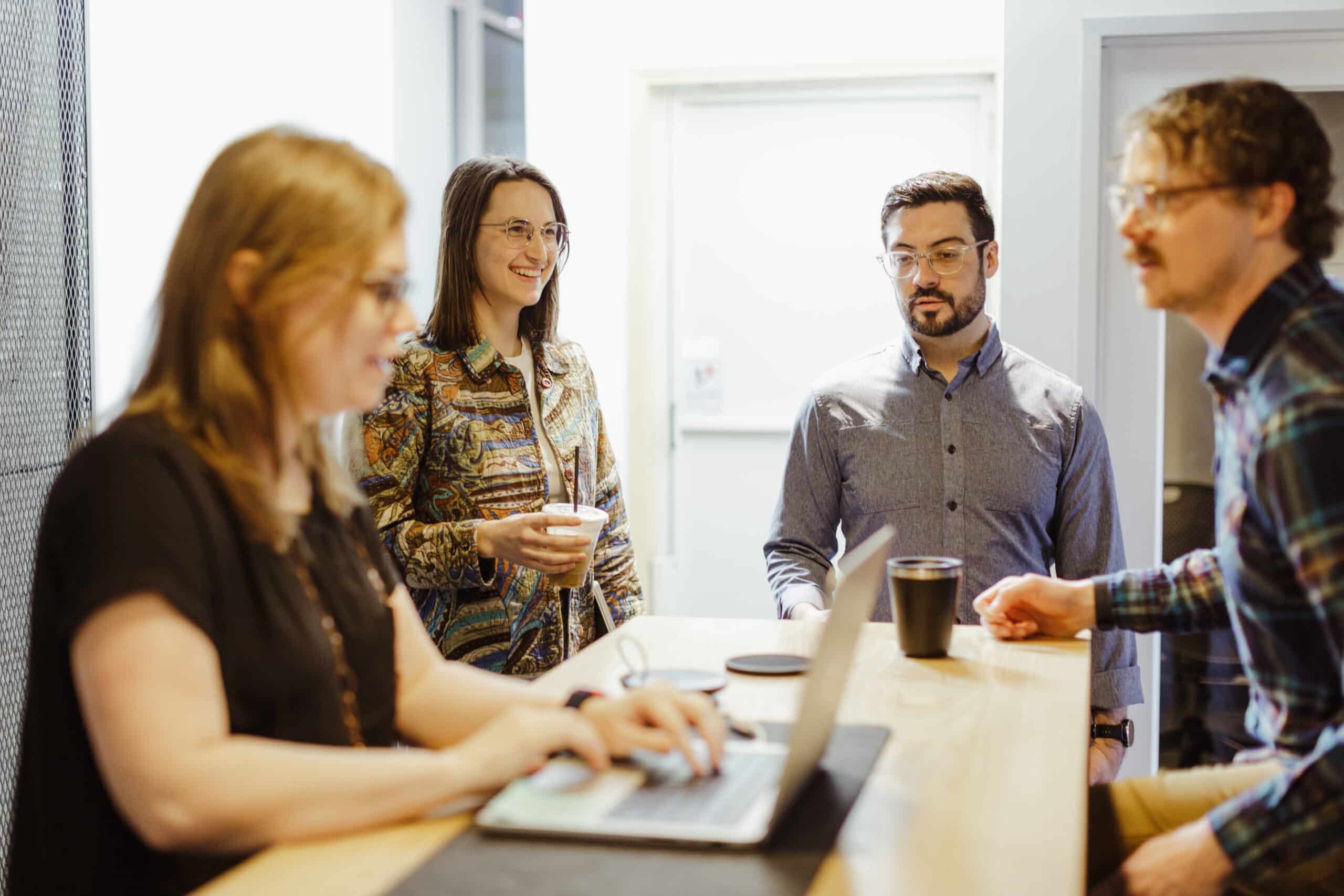 Developers at Atomic Object's Ann Arbor office. Post title: Finding Joy in the Challenge: 3 Ways to Navigate Tough Projects