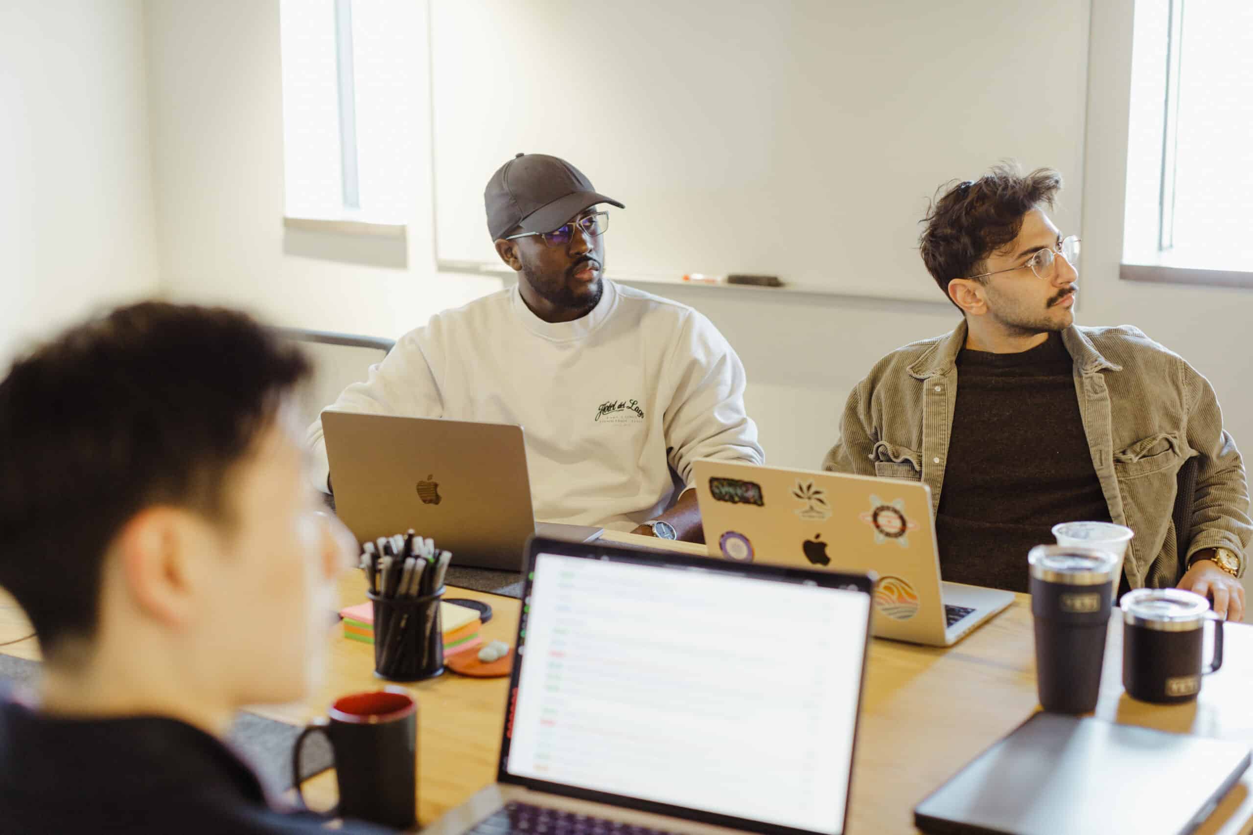 Pictured is author Sulaiman Bah with his co-workers. Post title: Here's How I Became Open to Using AI