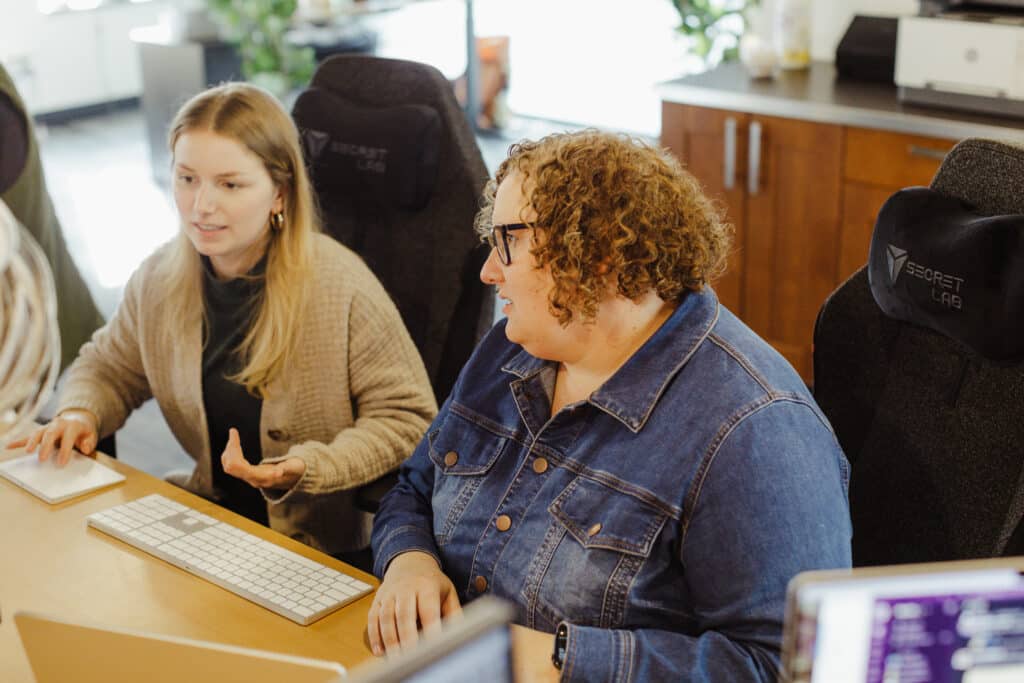 Author Isabella Wloch with a co-worker. Post title: Transitioning a Feature Between Development Teams: Lessons Learned