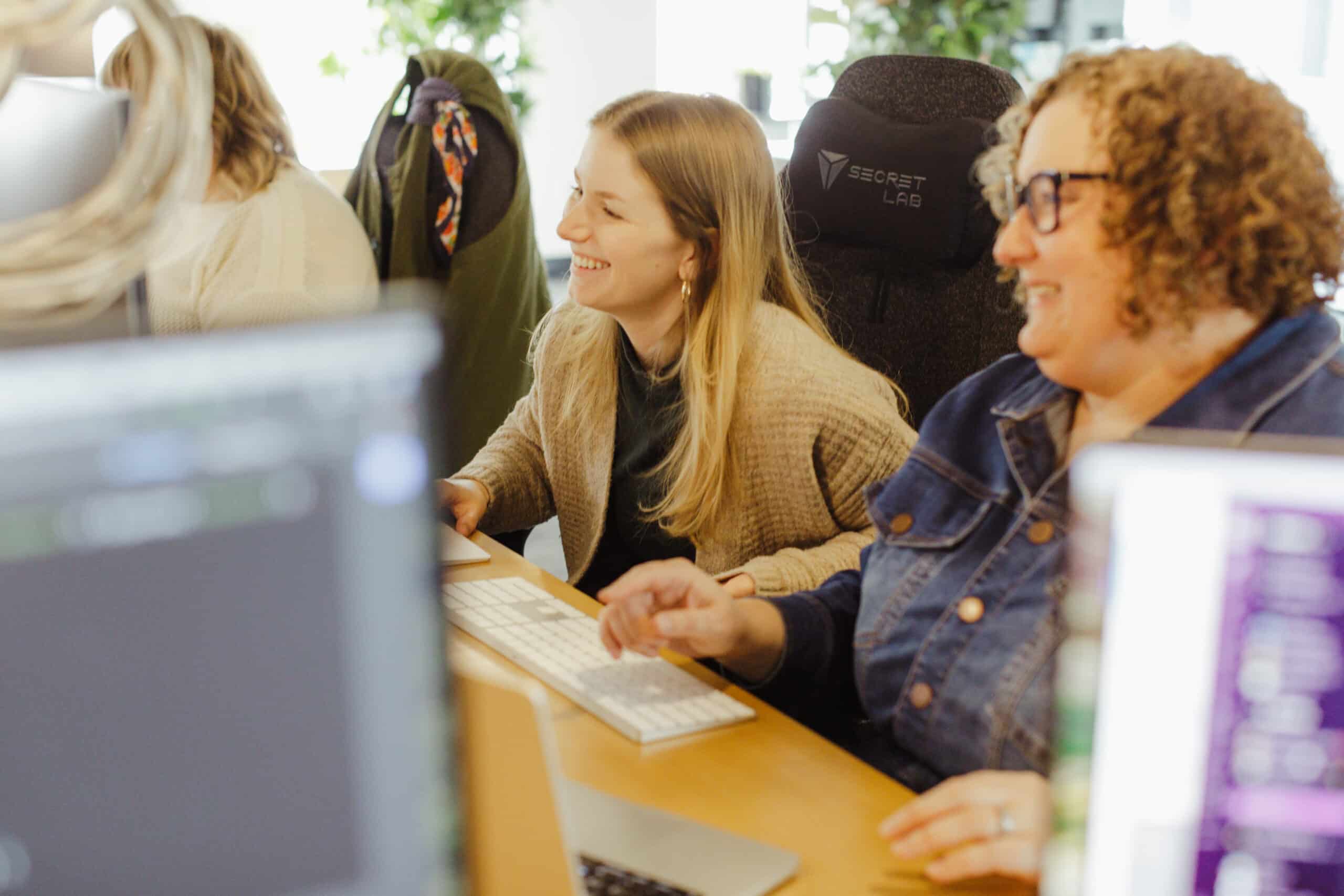 Pictured is author Kealy Williams laughing with a co-worker. Post title: The Power of Relationship