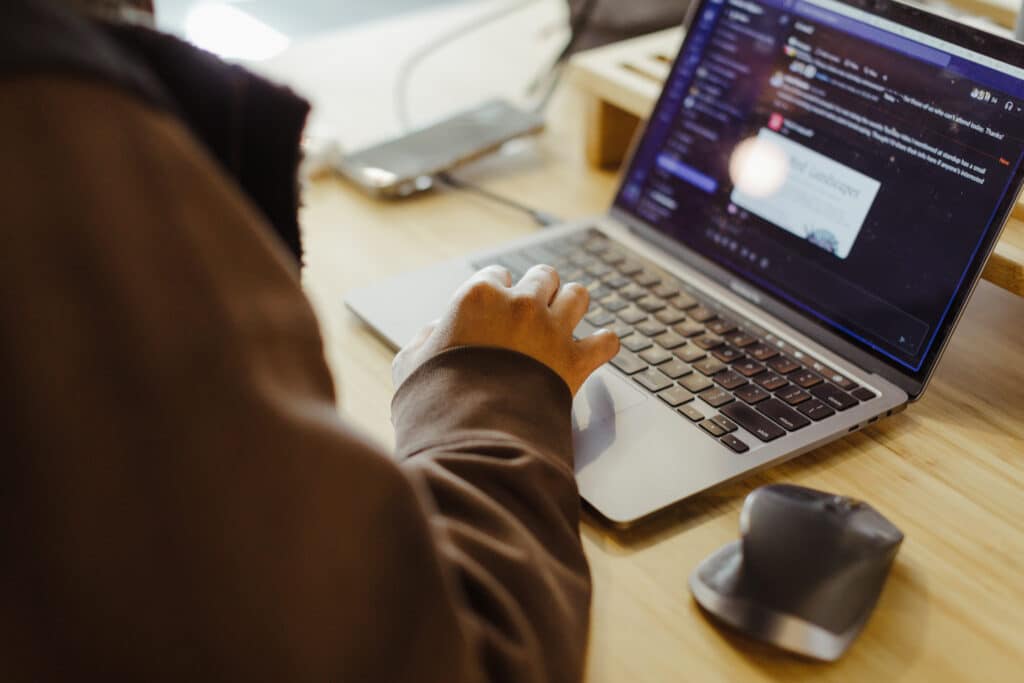 Pictured are hands on a keyboard. Post title: Maximize Vim with Macros