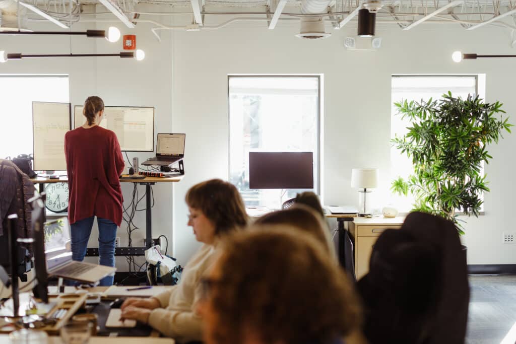 A view of the inside of the Atomic Object Ann Arbor office. Post title: Debugging in My First Language: A Bilingual Developer's Accidental Discovery