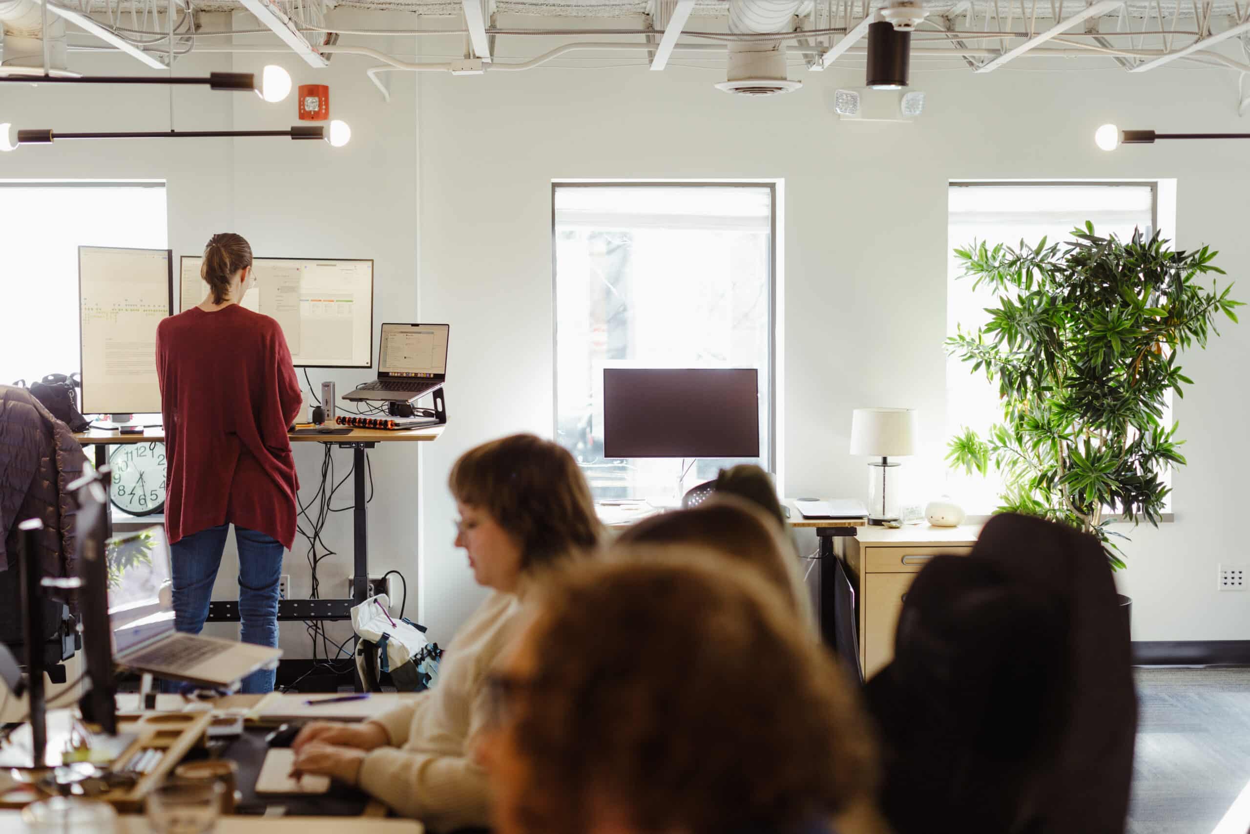 A view of the inside of the Atomic Object Ann Arbor office. Post title: Debugging in My First Language: A Bilingual Developer's Accidental Discovery