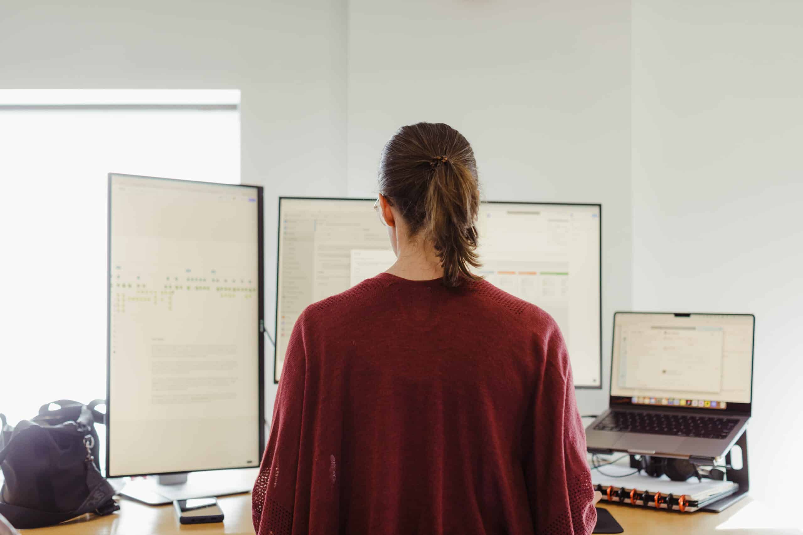 A developer in front of her monitor. Post title: Don't Stick a Laser In Your Face (A Parable): Power Tools & Ignorance