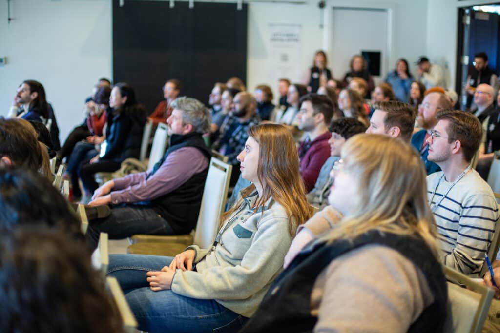 Pictured are attendees at AtomicCon 2024. Post title: Considering a Tech Conference? Dos Don'ts and Notes