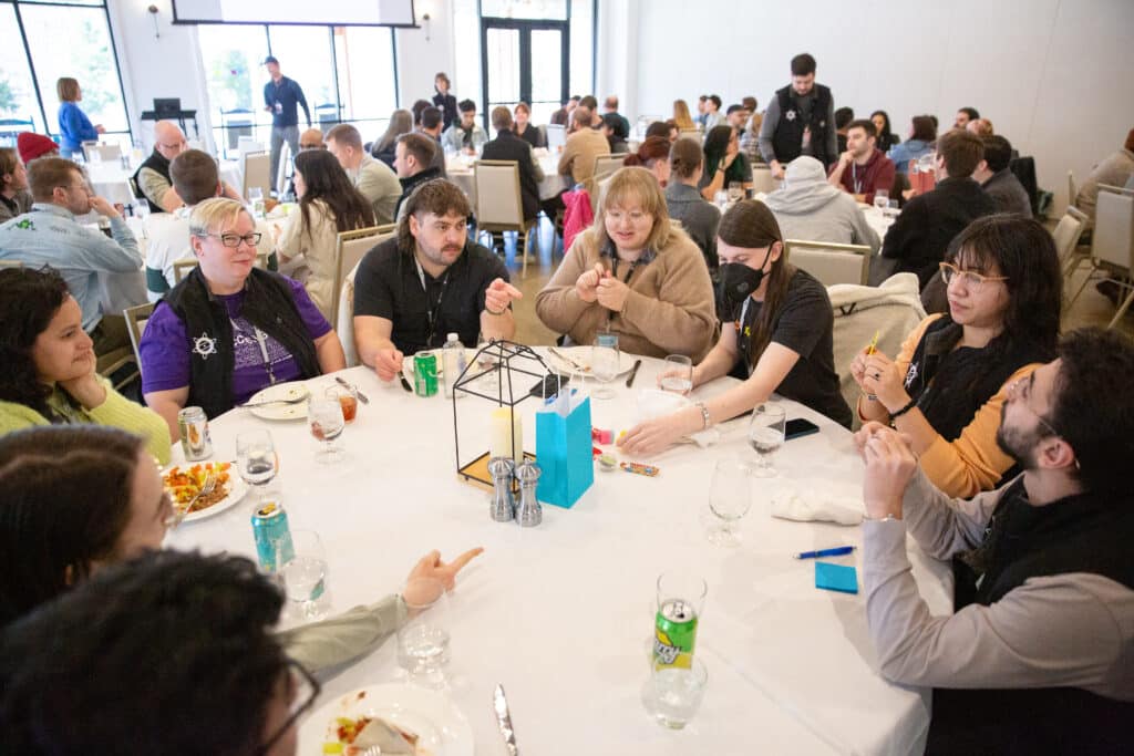 Pictured are Atomic Object employees attending Atomic Con 2024. Post title: Tips for Junior Developers to Land a Job