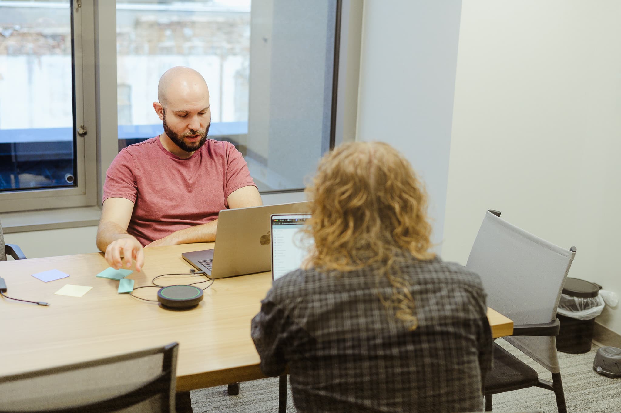 Pictured is author Andrew Marmorstein with a co-worker. Post title: Apply Iterative Development Practices to Legacy Modernization Projects