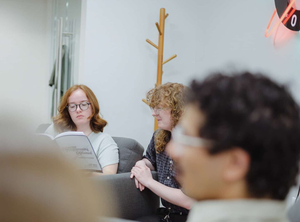 PIctured is author Ellie Jetton with co-workers. Post title: How to Connect Figma to Cursor Using the Figma MCP Server