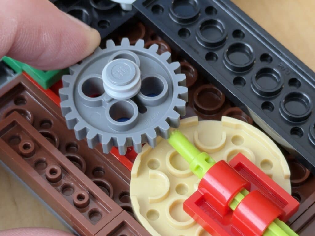 The ratchet mechanism that makes the TV tuner on the NES TV click. Illustrating a post titled: Building with LEGOs and Building Software for the Future