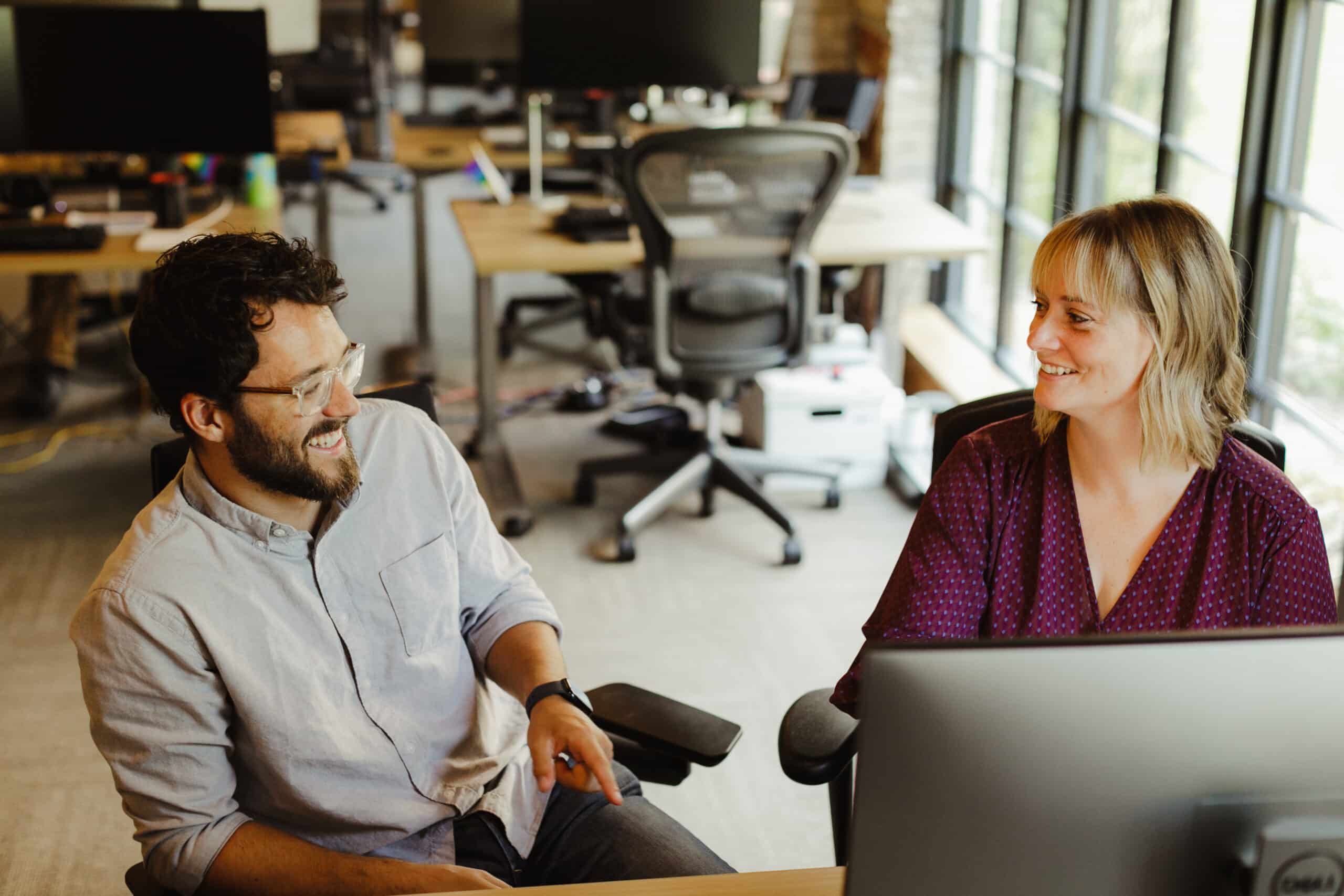 Pictureed is author Meg Kretz laughing with a co-workers. Post title: More Heart, Less Hype: Real Lessons from Building Nonprofit Tech