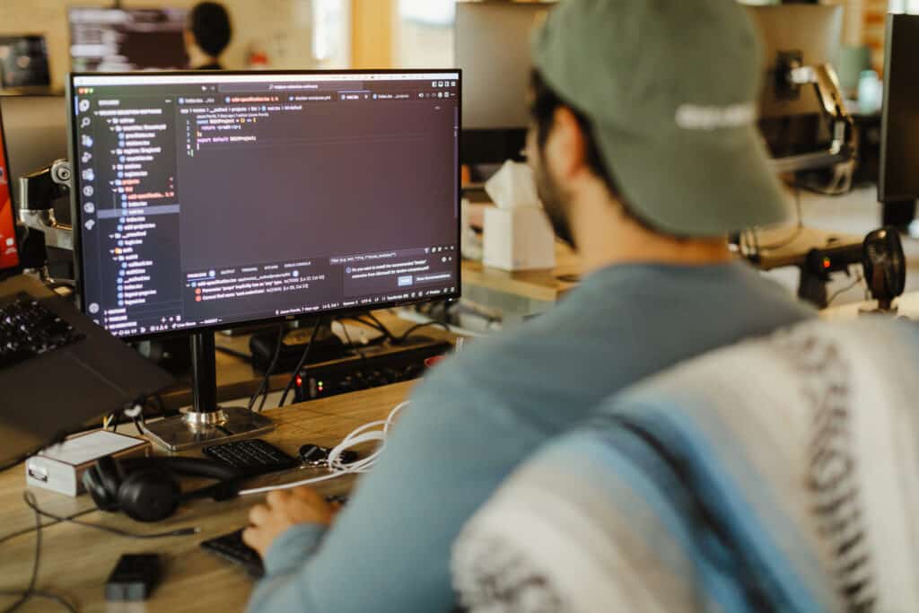 A developer looks at a monitor. Post title: How I Use Agents Without Stopping My Own Growth
