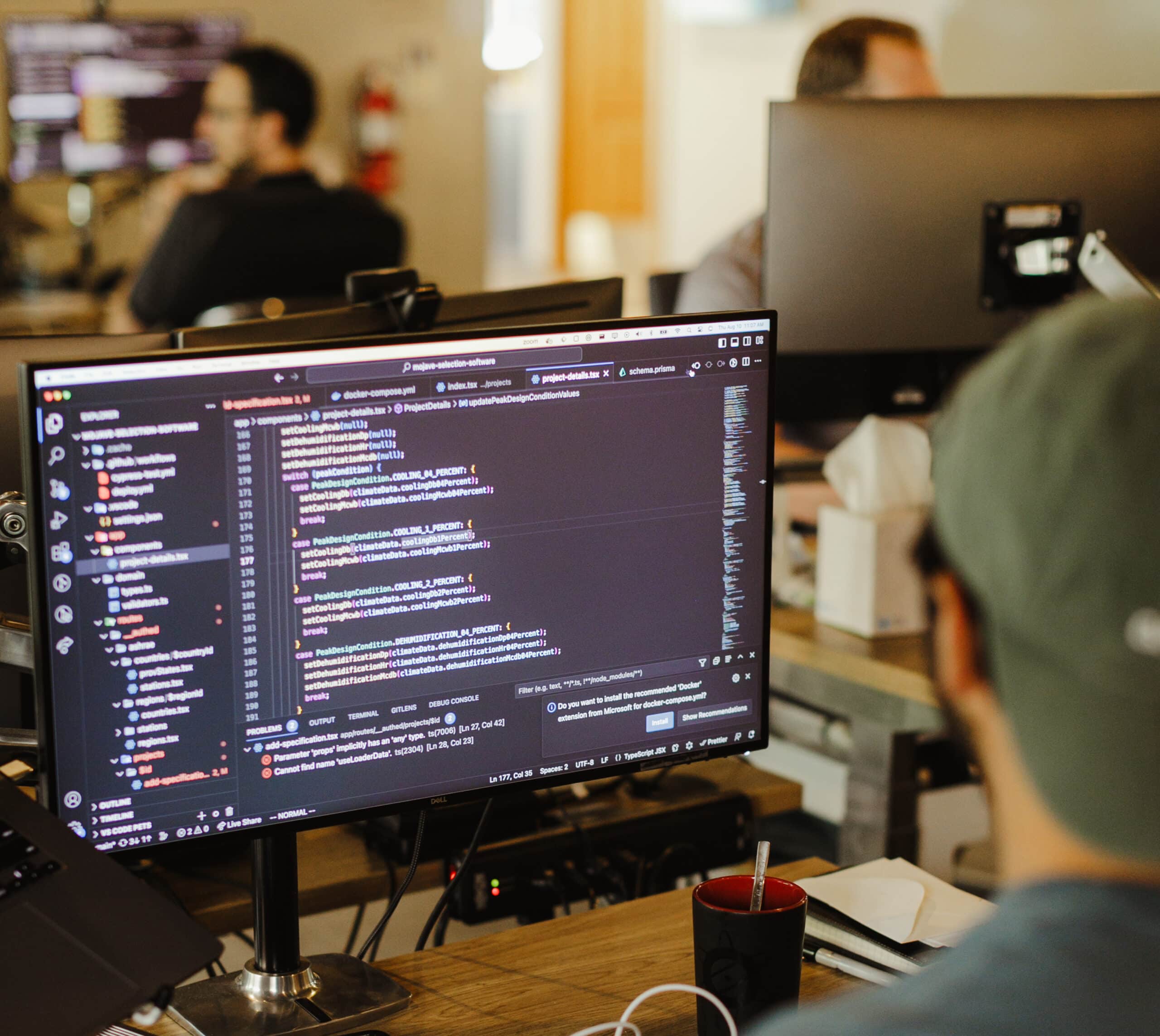 Developers at Atomic's Grand Rapids office. Post title: From Unity Prototypes to Production Pipelines: Growing Into C#
