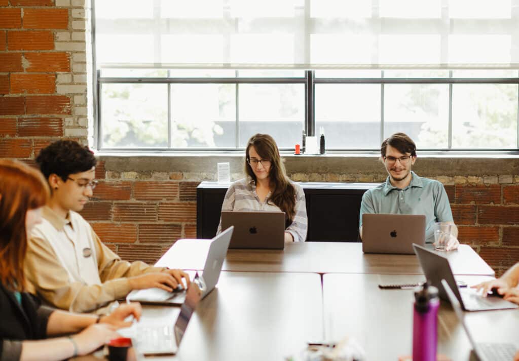 Author Dre Solorzano with colleagues. Post title: I Built a Pokémon Trainer AI With LangChain