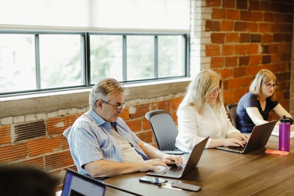 Pictured are author Kaitlin Diemer and co-workers, illustrating the post How Non-Developers Can Help with Technical Troubleshooting