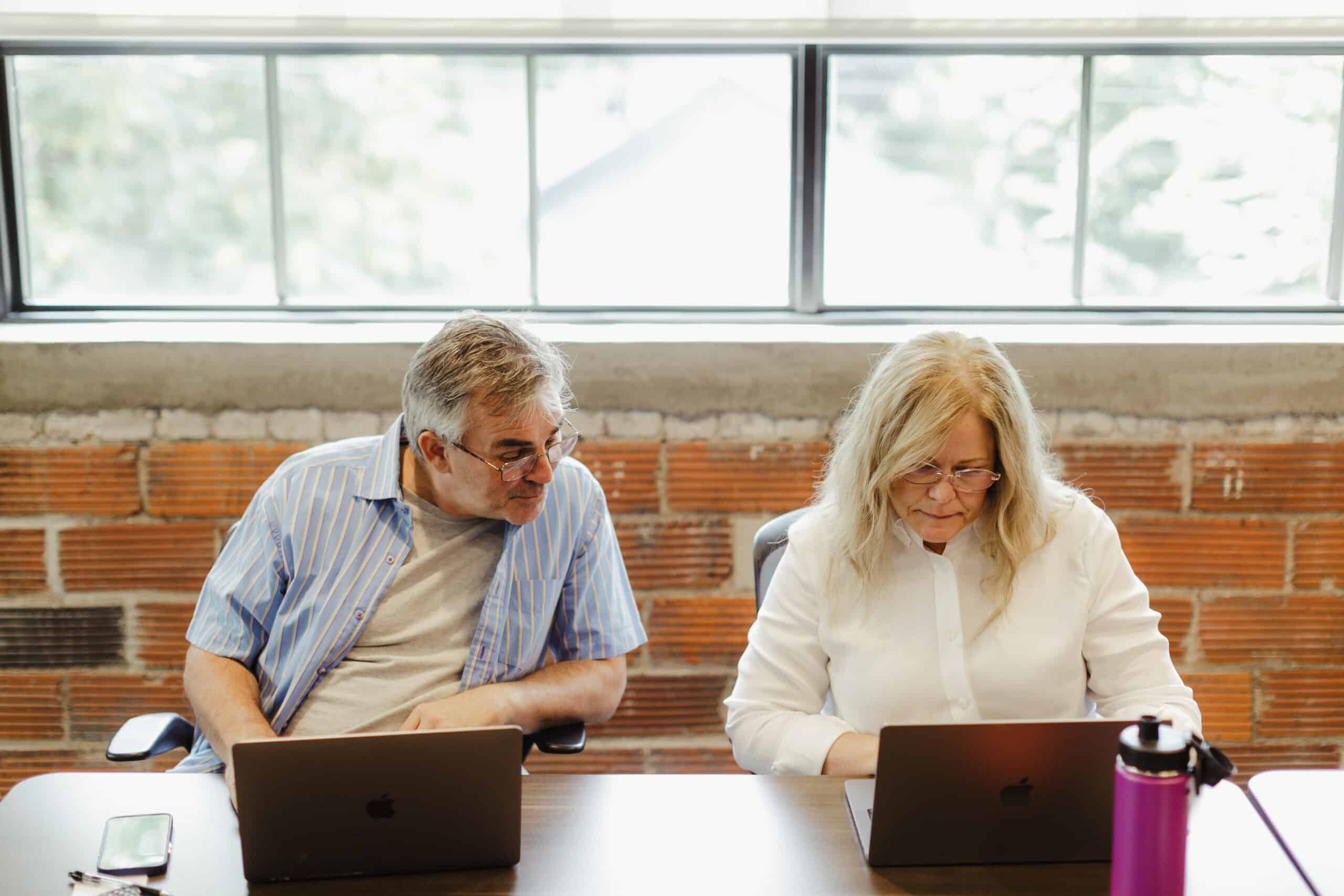 Pictured at right is an Atomic Object Delivery Lead listening to the QA guy at left saying: QATesting is Not Possible!