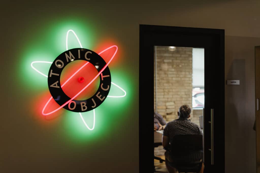 The interior of the Atomic Object Grand Rapids office. Post title: Prepare for a HIPAA-Audit Like It’s a Production Launch