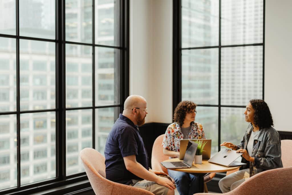 Pictured is author Lizzie Paris with colleagues. Post title: Authenticated Routes with TanStack Router