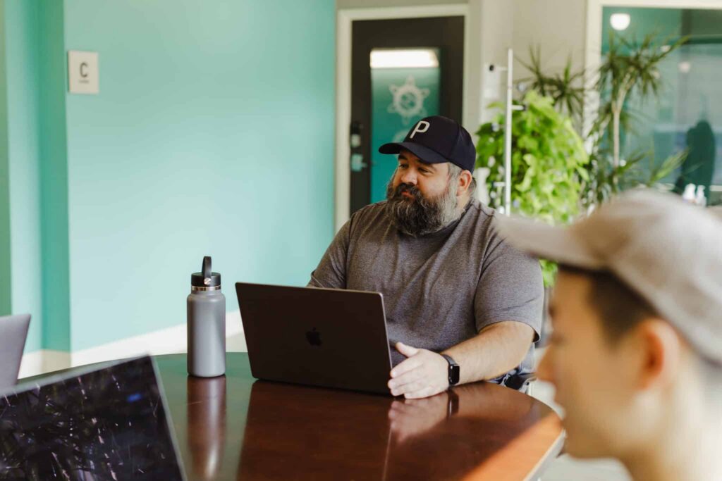 Author Rob Bell with colleagues. Post title: My Coding Agents Moved Off My Laptop and Onto a Remote Server