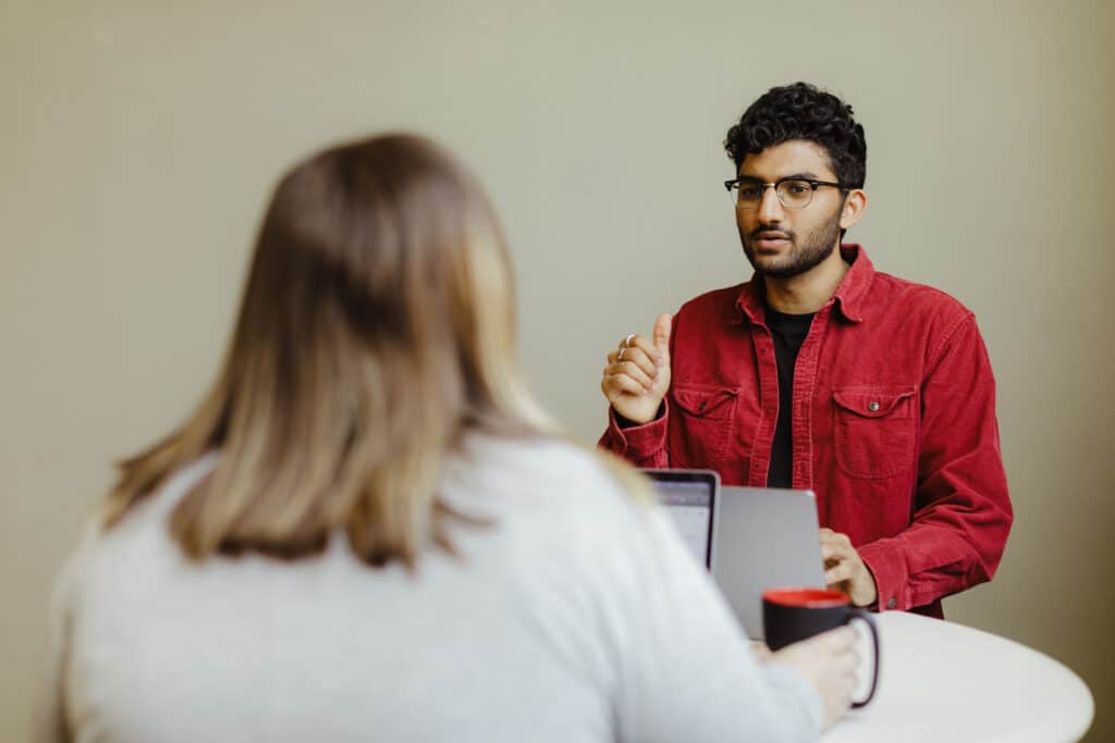 Author Sagar Rathod with a coworker. Post title: Graph-Style Queries vs. Joins: When Your REST API Hits a Wall