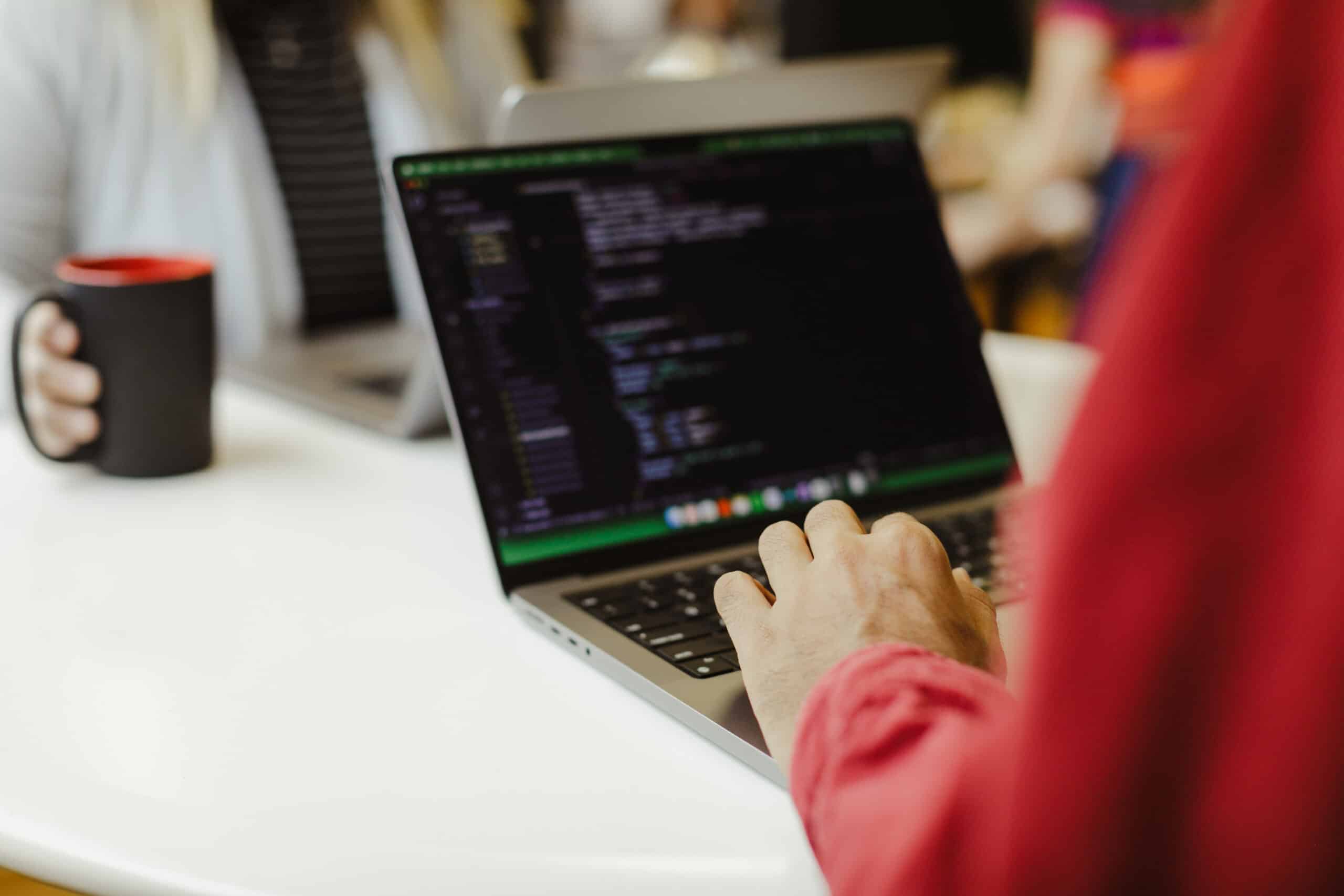 Hands on a keyboard. Post title: Elysia.js: Type-Safe APIs Without the Mess