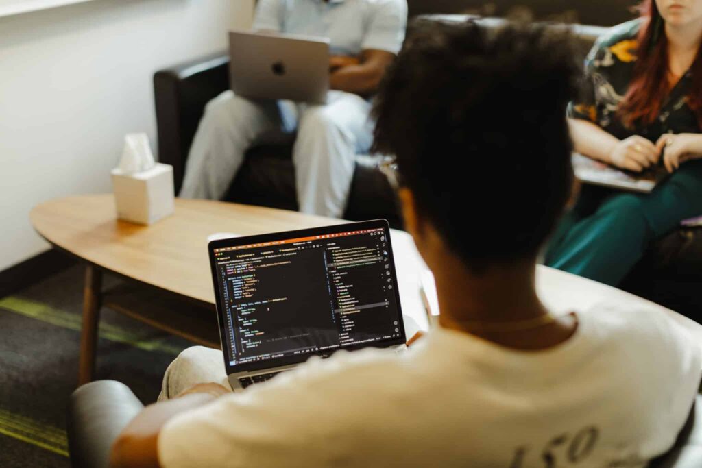 Developer Doug Shipp looks at a laptop where he's writing this post: Agentic Development in Practice: We Handed Off the Code, Not the Job