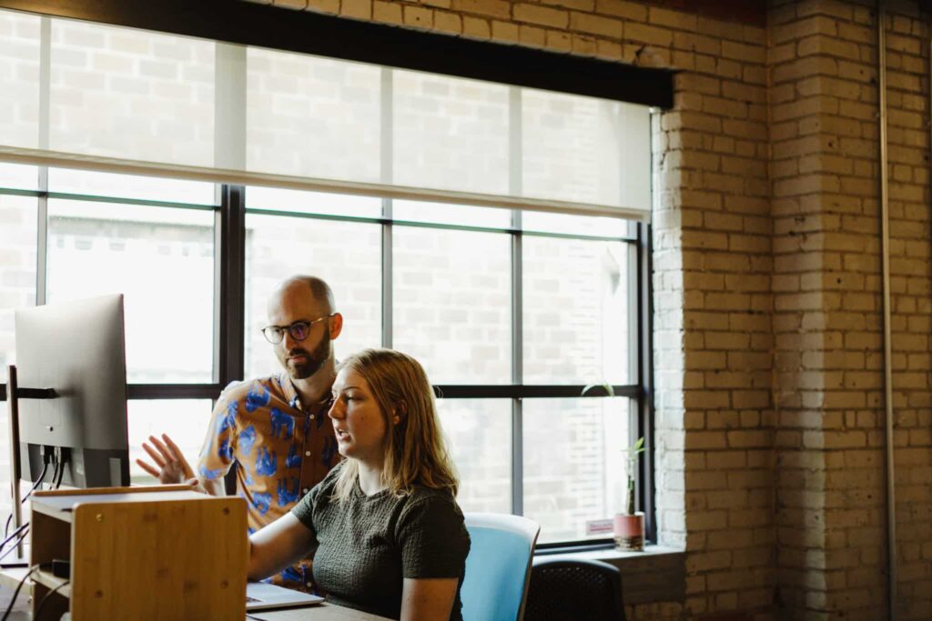 Shown are two Atomic co-workers, including Lauren Ebels, author of this post: AI Agents: Experience Doesn't Fit in a Prompt