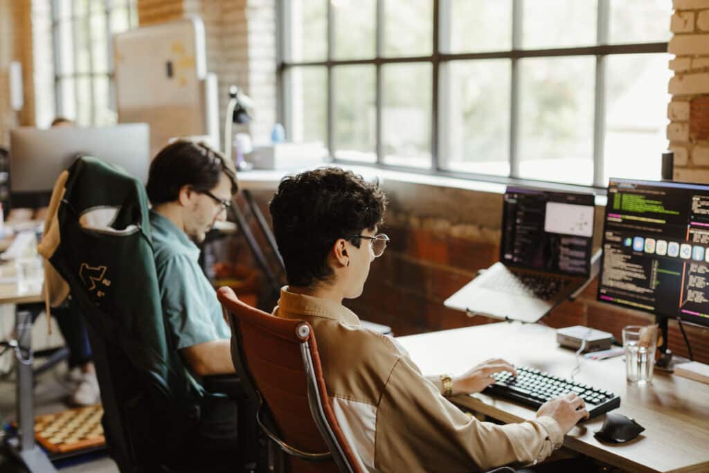 Two developers working together. Post title: If AI Can Build Anything, How Does that Affect the Craft of Development?