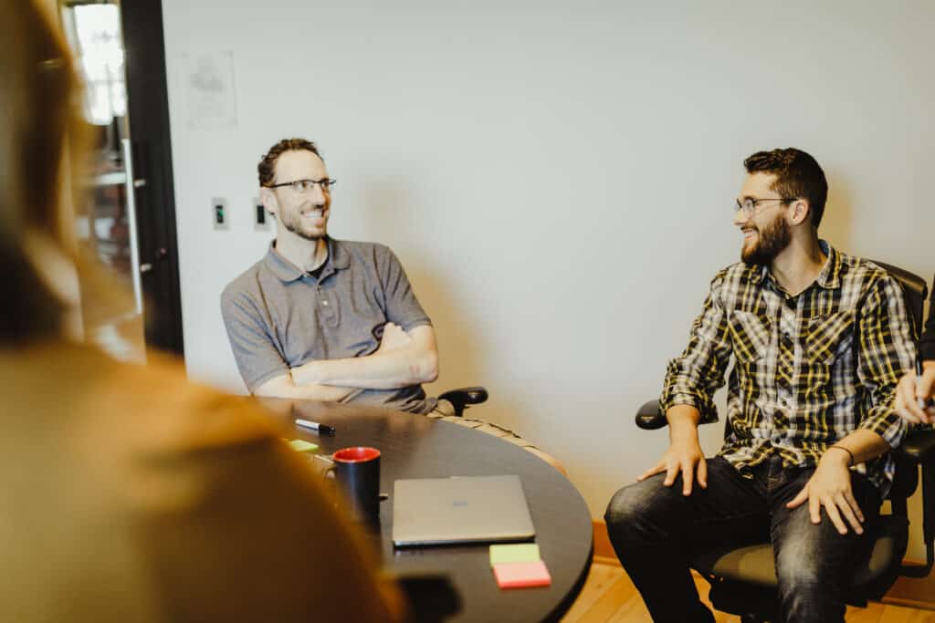 Pictured is author Patrick Bacon with co-workers. Post title: Log Your Entire ZSH History