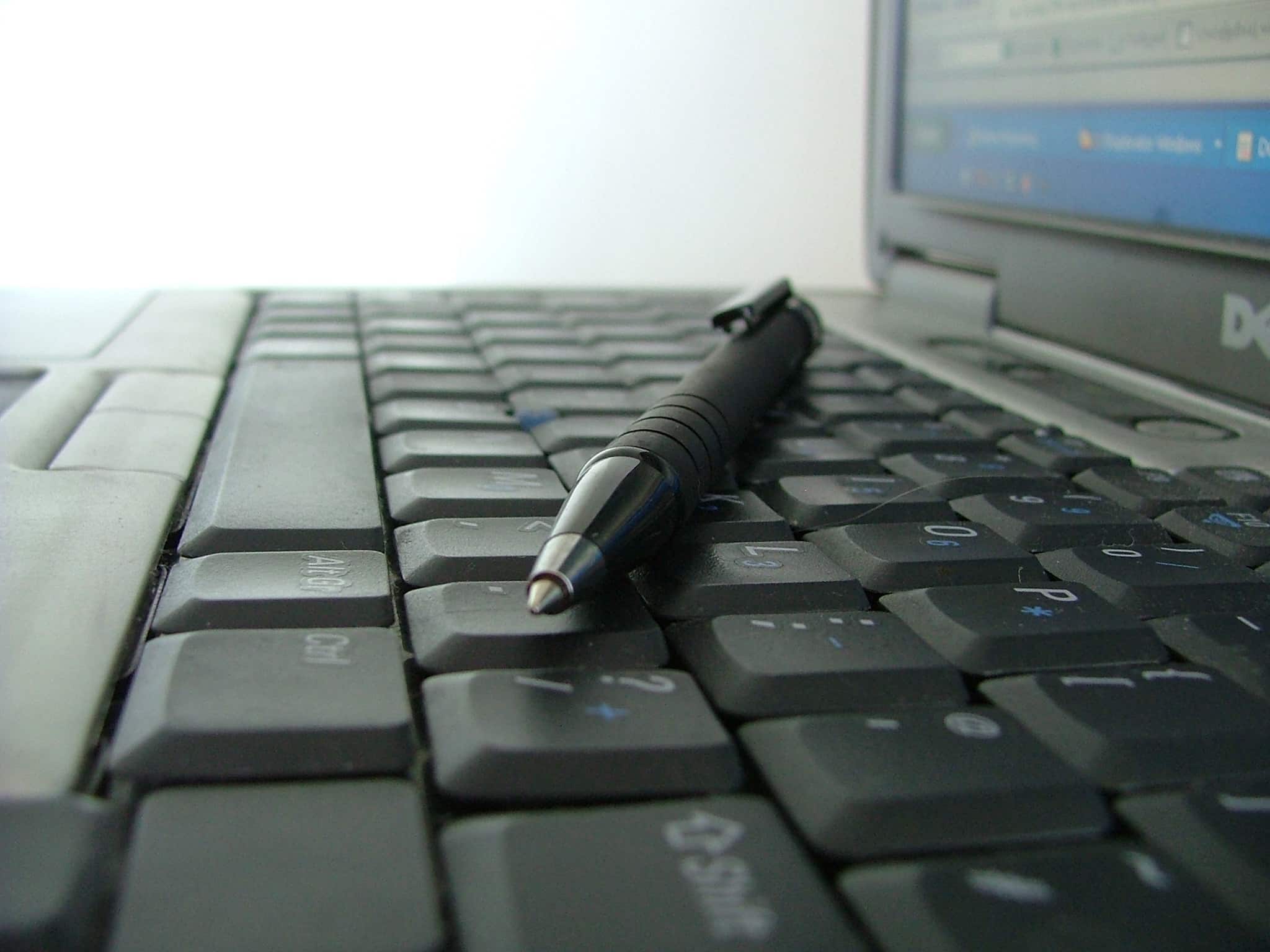 Shown is a keyboard with a pen resting on it. Post title: Review: Codex Tools for Improving Accessibility