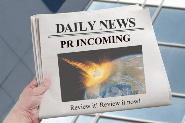 A hand holds up a newspaper titled "Daily News" with the headline "PR INCOMING." The front-page photo shows a flaming meteor about to strike Earth, with a small, cute pink cartoon character edited into the center of the fireball. The caption below reads "Review it! Review it now!"